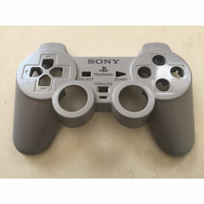 Plasturgie supérieur coque pièce détachée de manette de console de jeu de marque Sony type Playstation référence SCPH-1200